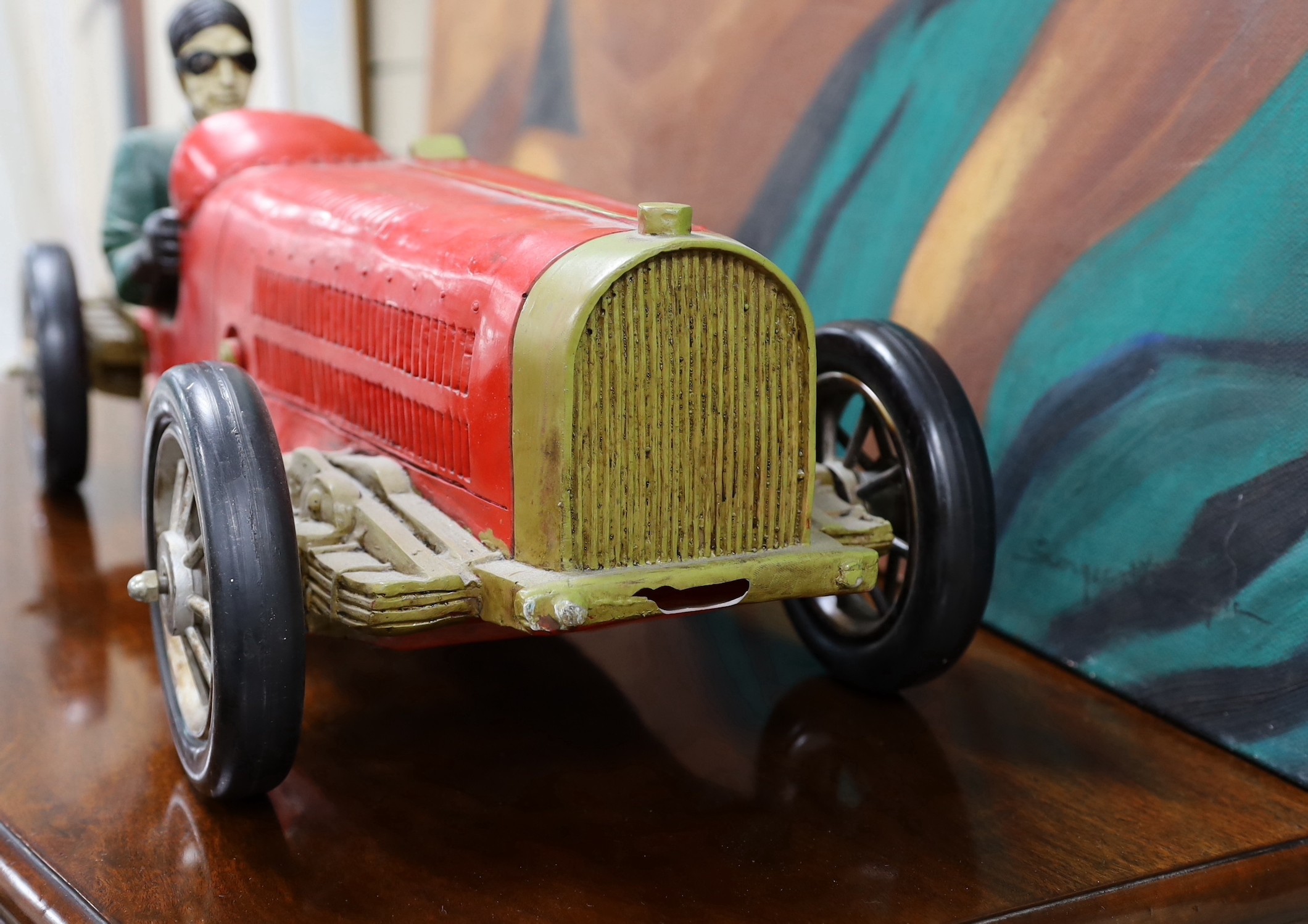 A resin model of an early 20th century Grand Prix racer in a Bugatti type 35